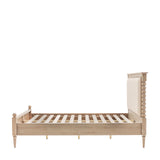 side view Antoine bed frame in limewashed oak with upholstered headboard and turned posts – elegant French country bedroom furniture