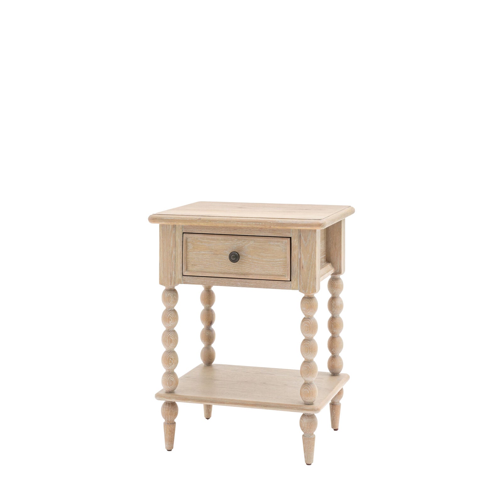 Antoine bedside table in limewashed oak with turned legs, single drawer, and open lower shelf – rustic and elegant bedroom furniture