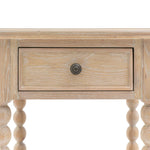 Antoine bedside table in limewashed oak with turned legs, single drawer, and open lower shelf – rustic and elegant bedroom furniture close up