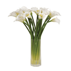 Artificial white cala lilies in a clear glass vase.