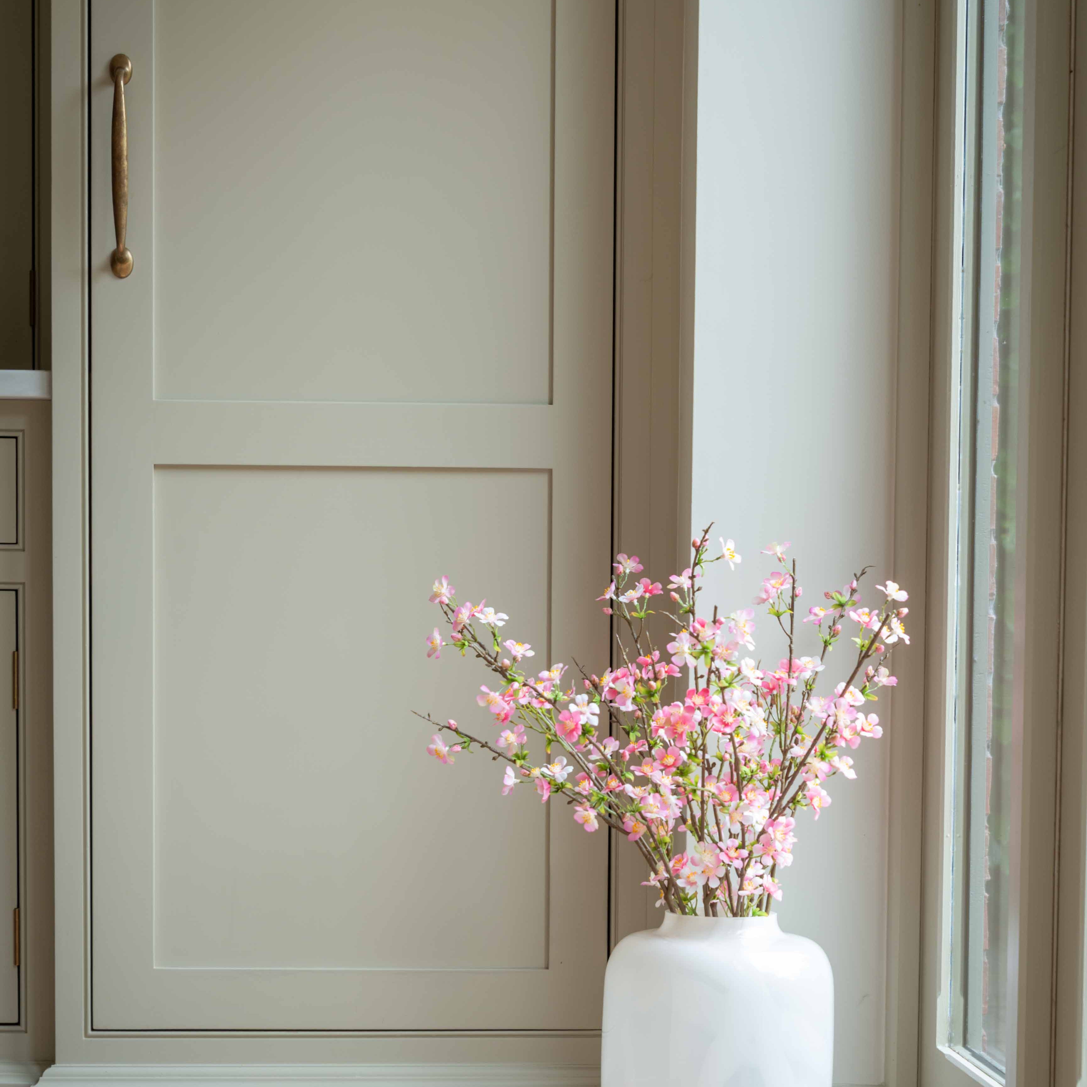 Bring a touch of springtime elegance to your home year-round with our faux pink apple blossom stem. Sold singularly, each stem features lifelike blooms in soft pink hues with delicate green foliage, offering a realistic and maintenance-free alternative to fresh flowers. Perfect for styling in a tall vase, adding a fresh and airy accent to kitchens, living rooms, or entryways.

Crafted with attention to detail, this artificial apple blossom branch is ideal for creating stunning floral arrangements or adding 