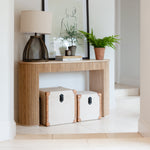 Fisherman cage table lamp on console table by staircase