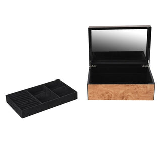 Close-up of the Goring jewellery box's black velvet interior, showing the ring slots along the back edge and the divided compartments