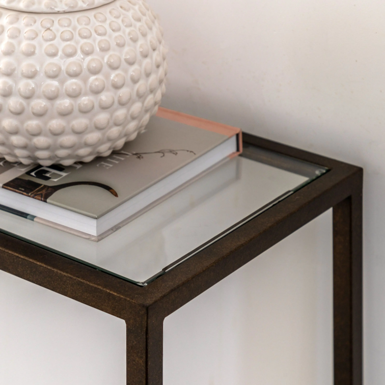Geneva Glass Console Table with clear glass shelves and modern metal frame in hallway
