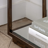 Geneva Glass Console Table with clear glass shelves and modern metal frame in hallway