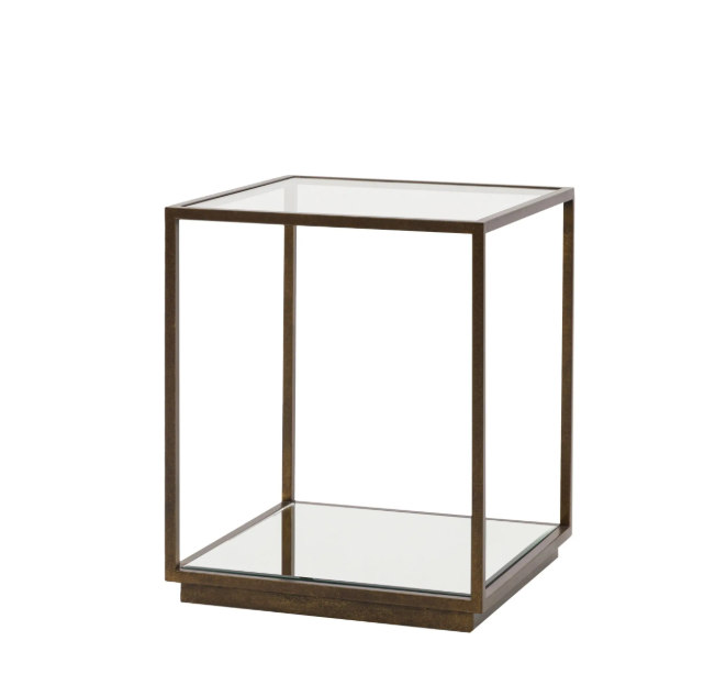 Glass side table with bronze metal frame on a white background