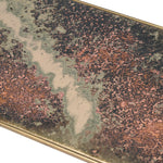 Indulge in the opulence of the Gianna Elegant Glass and Brass Console Table, a luxurious addition to any elegant space. The base of this elegant side table features a stunning oxidized finish.