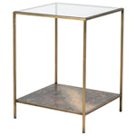 Indulge in the opulence of the Gianna Elegant Glass and Brass Side Table, a luxurious addition to any elegant space. The base of this elegant side table features a stunning oxidized finish.