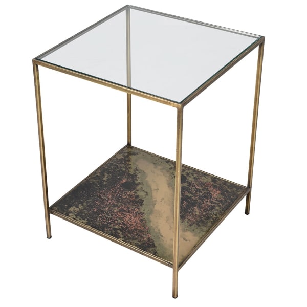 Indulge in the opulence of the Gianna Elegant Glass and Brass Side Table, a luxurious addition to any elegant space. The base of this elegant side table features a stunning oxidized finish.