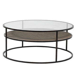 Daley round coffee table with blackened steel frame, clear 100cm glass top and woven natural rattan lower shelf for storage
