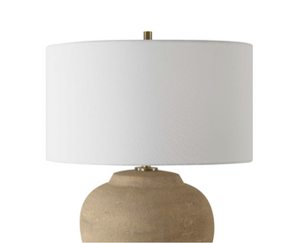 White linen drum shade meeting the terracotta base of the Hadleigh table lamp via a slim antique brass neck