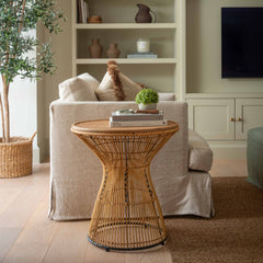 Add warmth and texture to your home with this handwoven rattan side table, the perfect boho accent piece for your modern coastal or Scandinavian-inspired living room. Featuring a sculptural hourglass silhouette and a natural cane top, this organic wicker end table blends artisanal charm with functional design. Lightweight yet sturdy, it offers the ideal surface for styling books, candles, or drinks beside your sofa. Perfect as a natural fiber coffee table, eco-friendly nightstand, or decorative pedestal in 