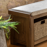 Hardwick Hall Bench made from oak and oak veneer with a cushioned seat and three seagrass storage baskets