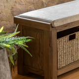 Hardwick Hall Bench made from oak and oak veneer with a cushioned seat and three seagrass storage baskets