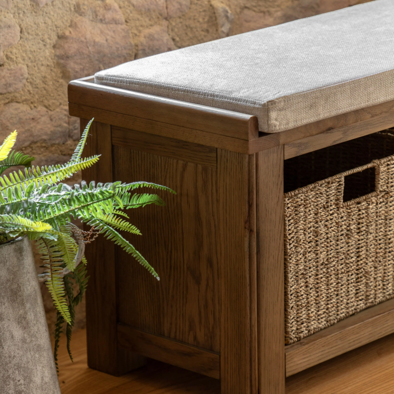 Hardwick Hall Bench made from oak and oak veneer with a cushioned seat and three seagrass storage baskets