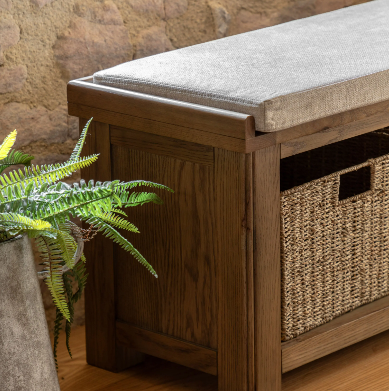 Hardwick Hall Bench made from oak and oak veneer with a cushioned seat and three seagrass storage baskets