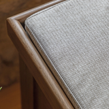 Hardwick Hall Bench made from oak and oak veneer with a cushioned seat and three seagrass storage baskets