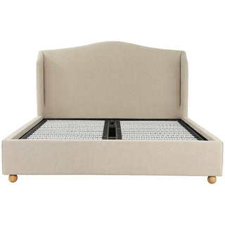Front view of the Harlyn winged upholstered bed showing the camelback headboard and slatted base