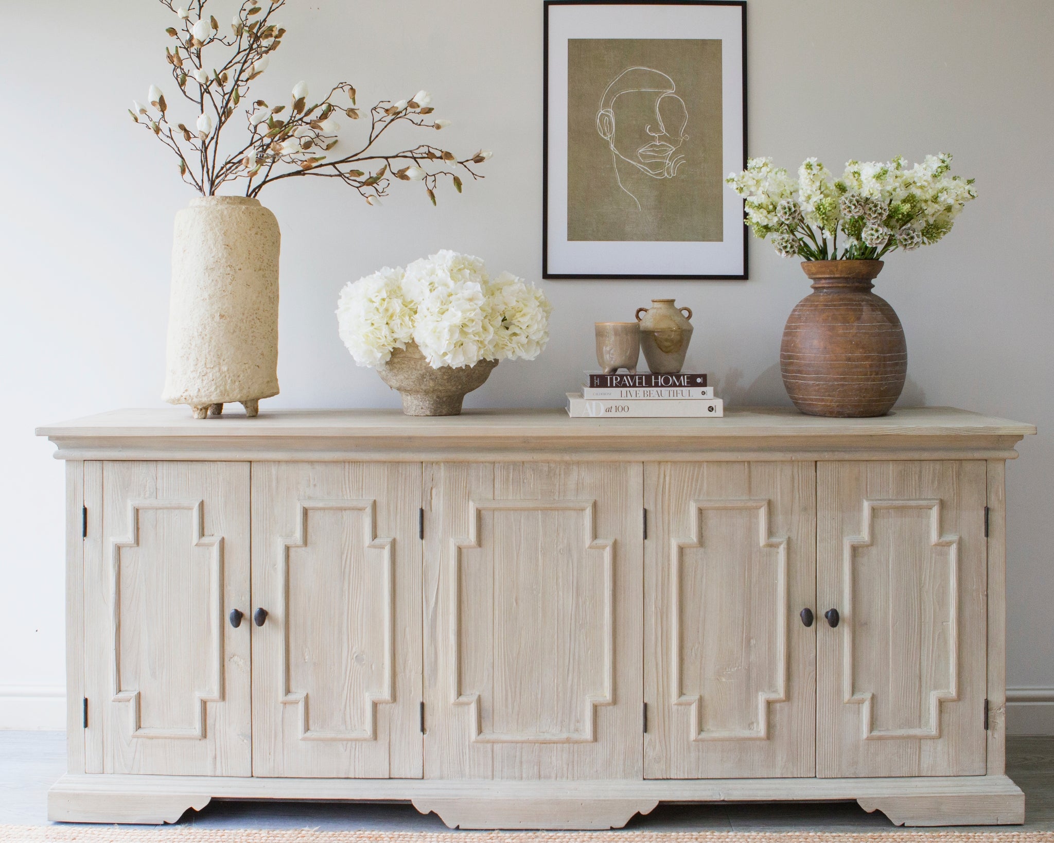 Styled Harrogate sideboard with vases and wall art