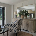 Harrogate sideboard styled with mirror and decor in living room