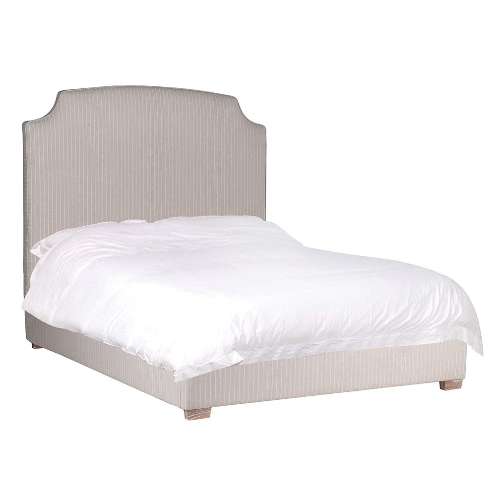 Henrietta upholstered bed with curved padded headboard and neutral fabric finish