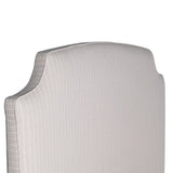 Henrietta upholstered bed with curved padded headboard and neutral fabric finish