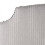 Henrietta upholstered bed with curved padded headboard and neutral fabric finish