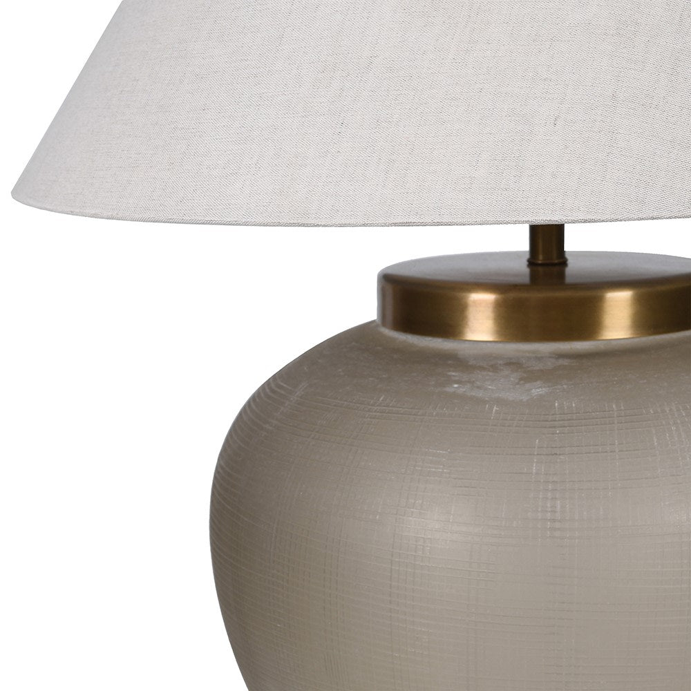 Elegant Hera glass table lamp with brass detailing and linen shade