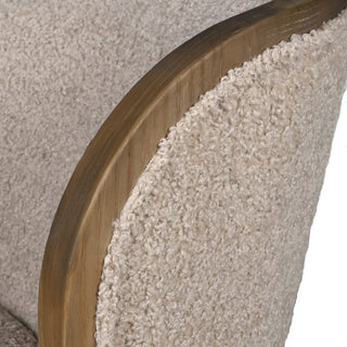 Close-up texture detail of the cream bouclé upholstery on the Holkham swivel chair