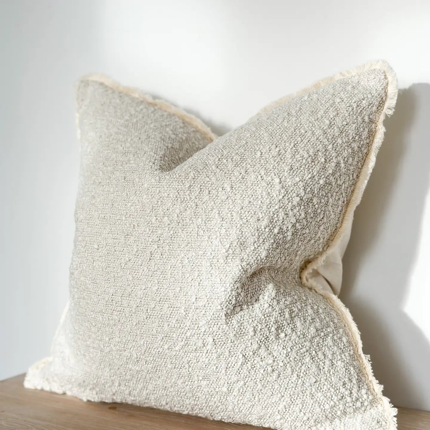 A stunning Cream Boucle cushion.
