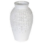 Close up of the vase showing an irregular pattern of raised bumps and lines