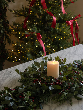 Faux olive leaf and red berry wreath, 30cm, as a festive table centrepiece