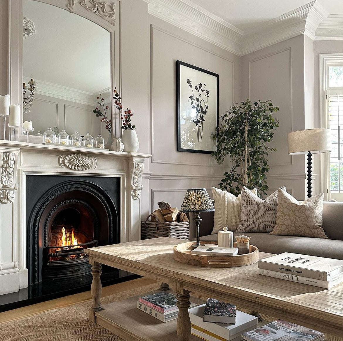 A stunning floor lamp in black featuring a beautiful turned base complete with off white linen shade.