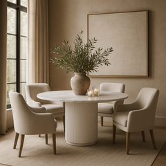 Indi Sintered Stone Dining Table styled in dining room with four beige chairs and vase centrepiece