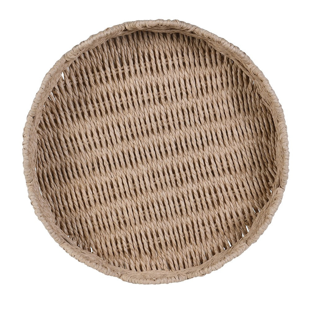 A round woven tray made from natural beige seagrass or wicker, shown from a top-down perspective on a solid white background.