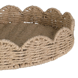 A round woven basket tray with a scalloped edge, made from natural tan jute or seagrass rope, shown on a plain white background.