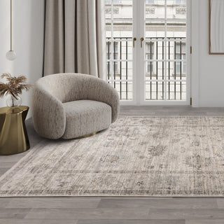 Jasper traditional rug in beige styled in a living room