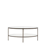 Jenner bronze glass coffee table with two tier oval glass shelves in a modern living room setting