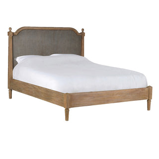 Kendal king size bed with arched woven cane headboard and weathered limed-wood frame, dressed in white