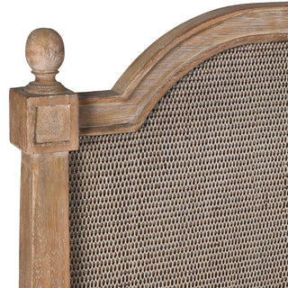 Close-up of Kendal bed headboard showing woven cane panel, moulded wood surround and carved ball finial