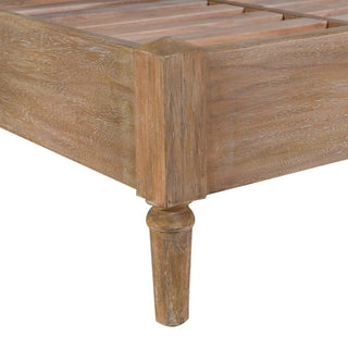 Detail of Kendal bed frame corner showing turned tapering leg and limed-wood finish