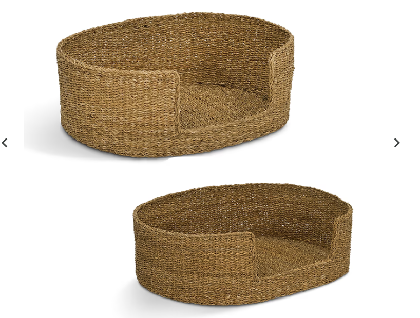 Two woven oval pet beds in natural jute or seagrass material, shown from different angles on a plain white background.