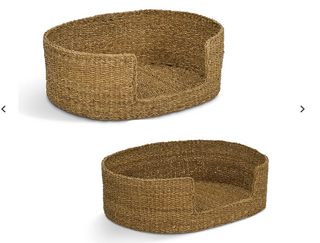 Two woven oval pet beds in natural jute or seagrass material, shown from different angles on a plain white background.