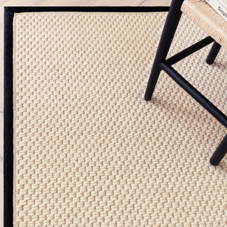 Close-up of the double loop texture on the Korra rug in charcoal and cream