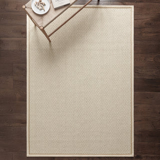 Korra Double Loop wool and jute rug in cream and linen styled in a living room