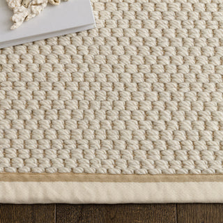 Close-up of the double loop texture on the Korra rug in cream and linen