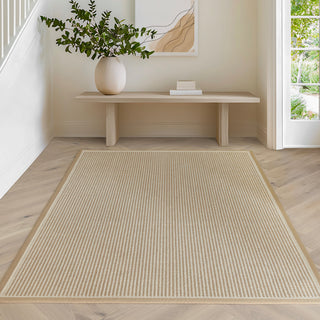 Korra Loop wool and jute rug in linen and cream styled in a living room