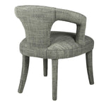 Indulge in the luxurious comfort of the Kristin Open Back Dining Chair, crafted with a woven textured fabric in a soft cream hue with subtle hints of moss green. Elevate your dining experience with this sophisticated and exclusive piece.