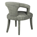 Indulge in the luxurious comfort of the Kristin Open Back Dining Chair, crafted with a woven textured fabric in a soft cream hue with subtle hints of moss green. Elevate your dining experience with this sophisticated and exclusive piece.