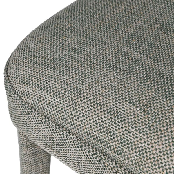Indulge in the luxurious comfort of the Kristin Open Back Dining Chair, crafted with a woven textured fabric in a soft cream hue with subtle hints of moss green. Elevate your dining experience with this sophisticated and exclusive piece.